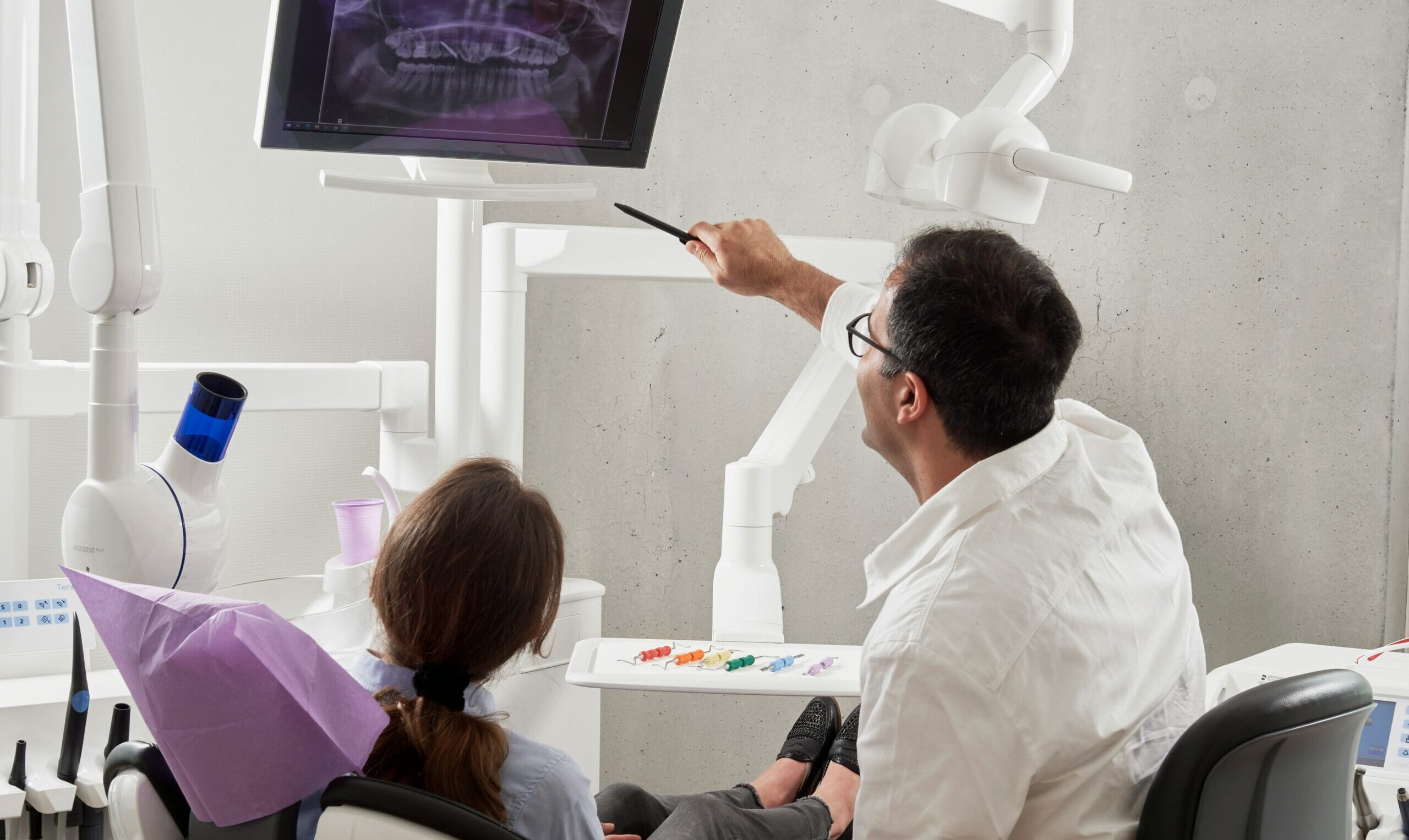 accountant for dentists - dental accountant pointing at screen